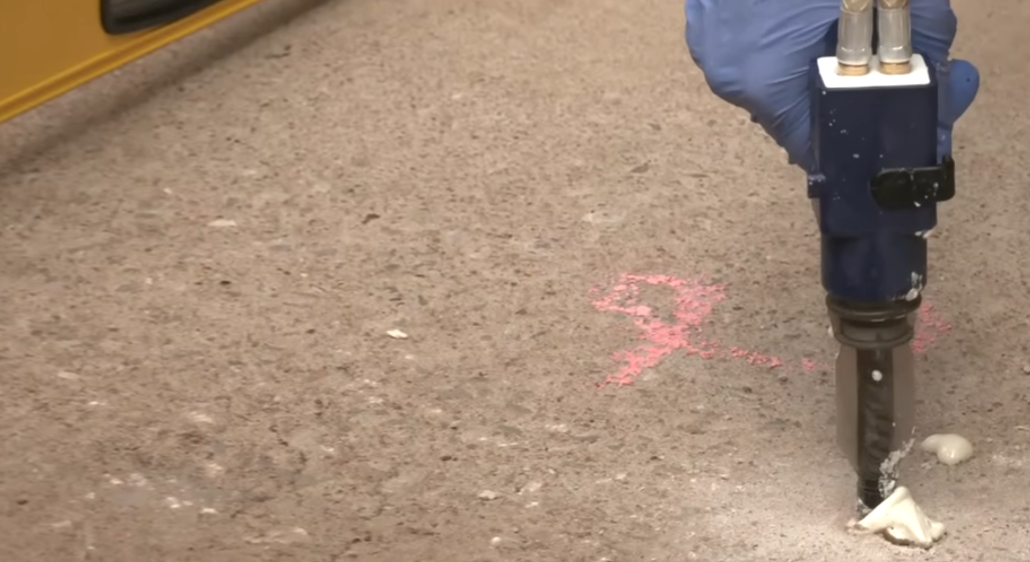 Polyjacking service injecting polyurethane foam to lift a concrete slab