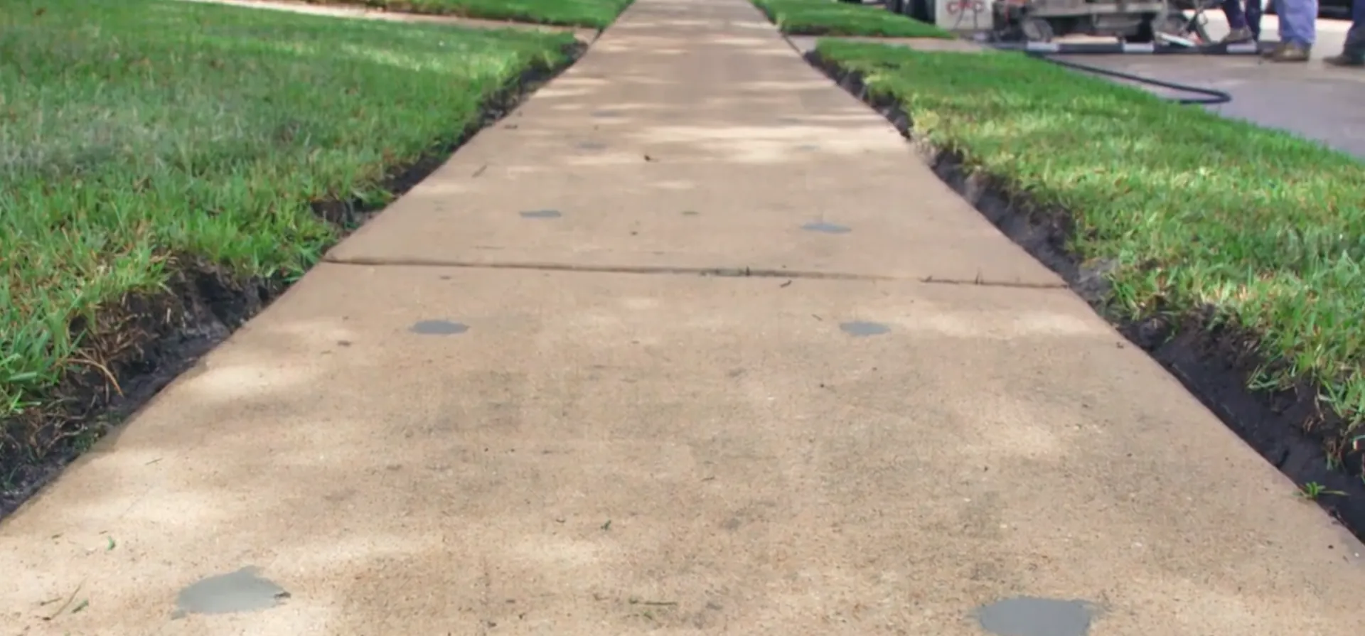 After sidewalk repair - smooth flush surface with no trip hazard