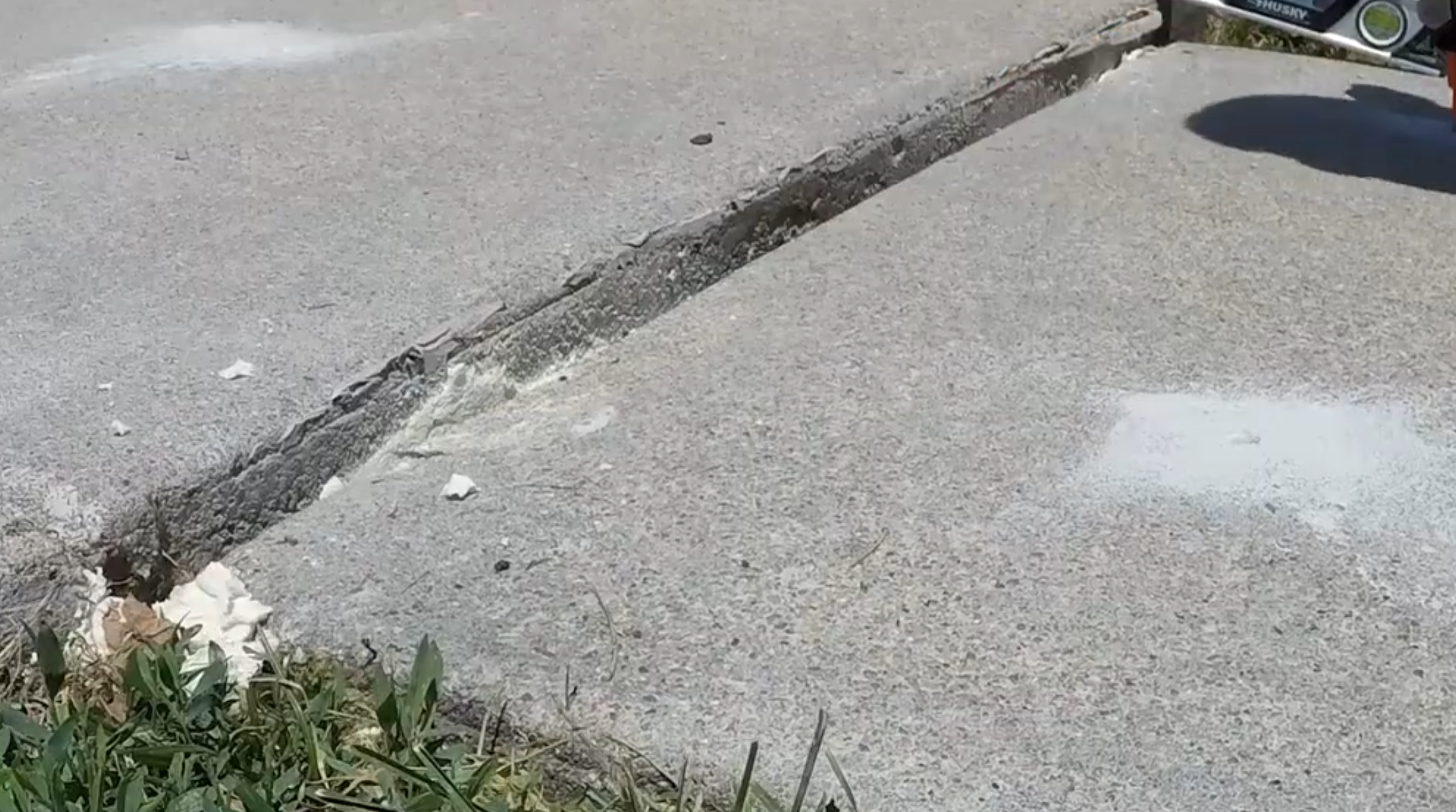 Before garage apron repair - sunken and cracked